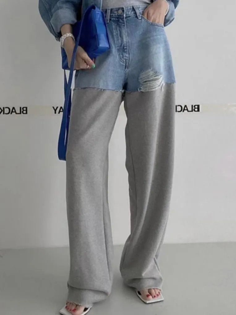 Blue jeans detail and gray pants